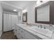 Bright bathroom features double sinks, a large mirror, and ample counter space on a well-lit vanity at 4931 Pine Ridge Rd, Charlotte, NC 28226