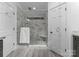 Bathroom with marble tile walk-in shower and a built-in seat at 4931 Pine Ridge Rd, Charlotte, NC 28226