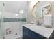 Updated bathroom features a walk-in shower, modern vanity, and a stylish mirror at 4931 Pine Ridge Rd, Charlotte, NC 28226