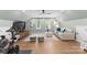 Spacious bonus room with hardwood floors, television, and natural light at 4931 Pine Ridge Rd, Charlotte, NC 28226