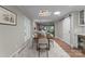 Dining room featuring a modern light fixture and convenient access to the kitchen area at 4931 Pine Ridge Rd, Charlotte, NC 28226