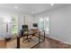Bright home office with hardwood floors, natural light from multiple windows, and built-in shelving at 4931 Pine Ridge Rd, Charlotte, NC 28226