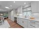 Kitchen featuring white cabinets, stainless steel appliances, built-in wine cooler, and modern finishes at 4931 Pine Ridge Rd, Charlotte, NC 28226