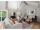 Cozy living room showcasing a fireplace, hardwood floors, and comfortable seating arrangement at 4931 Pine Ridge Rd, Charlotte, NC 28226