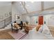 Stylish living room with high ceilings, modern lighting, and comfortable seating by the front door at 4931 Pine Ridge Rd, Charlotte, NC 28226