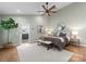 Bright main bedroom featuring a ceiling fan, ensuite bathroom, and neutral color palette at 4931 Pine Ridge Rd, Charlotte, NC 28226