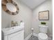 Chic powder room with unique mirror and tasteful decor at 4931 Pine Ridge Rd, Charlotte, NC 28226