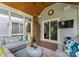 Comfortable screened porch with a vaulted wood ceiling and ample seating at 4931 Pine Ridge Rd, Charlotte, NC 28226