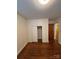 Bedroom with hardwood floors, white trim, and a closet for storage at 5119 Beckford Dr, Charlotte, NC 28226