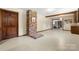 Basement with brick fireplace and tile flooring at 5303 Rogers Rd, Monroe, NC 28110