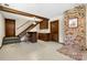 Finished basement featuring a wet bar, stairs, and fireplace at 5303 Rogers Rd, Monroe, NC 28110