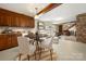 Finished basement featuring a dining area, seating area and full kitchen with dark wood cabinetry at 5303 Rogers Rd, Monroe, NC 28110