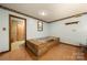 Features a large soaking tub with wood deck and vintage wallpaper border at 5303 Rogers Rd, Monroe, NC 28110