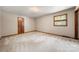 Bright bedroom with a window and neutral carpeting at 5303 Rogers Rd, Monroe, NC 28110