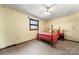 Bedroom with carpet flooring and natural light through window at 5303 Rogers Rd, Monroe, NC 28110