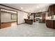 Spacious kitchen featuring stainless steel appliances, granite countertops and dark wood cabinets at 5303 Rogers Rd, Monroe, NC 28110