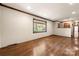 The expansive living room offers recessed lighting, wood floors, and nice wood trim at 5303 Rogers Rd, Monroe, NC 28110