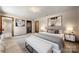 Relaxing main bedroom with a neutral color palette, soft lighting, and an ensuite bathroom at 5303 Rogers Rd, Monroe, NC 28110