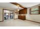 Mud room featuring tile flooring, wooden cabinets and sliding glass doors to the garage at 5303 Rogers Rd, Monroe, NC 28110