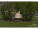 Welcoming entrance with an address sign nestled among lush greenery, adding curb appeal at 6035 Idlebrook Dr, Charlotte, NC 28212