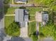 An aerial view showing the layout of the house, large yard, driveway, and detached garage at 6035 Idlebrook Dr, Charlotte, NC 28212