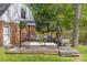 A cozy backyard deck, adorned with a charming pergola and comfortable seating, offering an inviting space at 6035 Idlebrook Dr, Charlotte, NC 28212