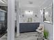 Modern bathroom with double sinks, stylish tile, and a glass-enclosed shower at 6035 Idlebrook Dr, Charlotte, NC 28212