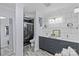 Stylishly renovated bathroom with dual sinks, modern tile accents, a sleek shower, and elegant fixtures at 6035 Idlebrook Dr, Charlotte, NC 28212