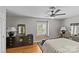 This cozy bedroom showcases hardwood floors, neutral walls, and updated light fixtures at 6035 Idlebrook Dr, Charlotte, NC 28212