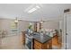 Open-concept living area featuring hardwood floors, stylish furniture, and seamless integration with kitchen area, ideal for modern living at 6035 Idlebrook Dr, Charlotte, NC 28212