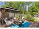 Charming outdoor dining area with a patio, table, and chairs, perfect for enjoying meals in the garden at 6035 Idlebrook Dr, Charlotte, NC 28212