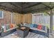 Inviting outdoor seating area featuring a fire pit, comfortable seating, and stylish decor for relaxing evenings at 6035 Idlebrook Dr, Charlotte, NC 28212