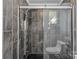 Large, glass enclosed shower with wall jets, shower wand, and modern tile at 6035 Idlebrook Dr, Charlotte, NC 28212