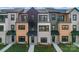 Beautiful modern townhomes featuring a variety of exterior finishes, balconies, and well-maintained landscaping at 714 Falling Oak Aly # 18, Huntersville, NC 28078