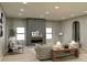 Contemporary living room featuring neutral tones, modern furniture, and a decorative fireplace at 714 Falling Oak Aly # 18, Huntersville, NC 28078