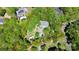 Aerial view of property featuring mature trees, lush landscaping, pool, and defined property lines at 729 Lochaven Rd, Waxhaw, NC 28173