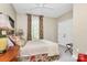 Inviting bedroom with natural light, ceiling fan, bed, and warm accents at 729 Lochaven Rd, Waxhaw, NC 28173