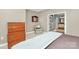 Serene bedroom with neutral walls and a direct view into the bathroom through open French doors at 729 Lochaven Rd, Waxhaw, NC 28173