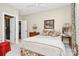 Cozy bedroom with warm lighting, carpet floor, queen bed, and dresser at 729 Lochaven Rd, Waxhaw, NC 28173