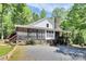 Beautiful home featuring a screened-in porch, stone accents, and a well-maintained yard at 729 Lochaven Rd, Waxhaw, NC 28173