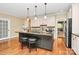 Well-equipped kitchen with stainless steel appliances, custom cabinets, and center island at 729 Lochaven Rd, Waxhaw, NC 28173