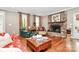 Inviting living room with hardwood floors, stone fireplace, and comfortable seating at 729 Lochaven Rd, Waxhaw, NC 28173