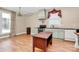 Open living space with hardwood floors, custom kitchen details, and a large window at 729 Lochaven Rd, Waxhaw, NC 28173