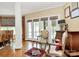 Bright living room with hardwood floors, neutral paint, decorative windows and multiple seating areas for conversation at 729 Lochaven Rd, Waxhaw, NC 28173