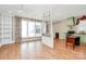Open-concept living space with hardwood floors, bright windows, and decorative columns at 729 Lochaven Rd, Waxhaw, NC 28173