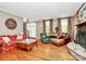 Comfortable living room featuring hardwood floors, stone fireplace, and ample seating at 729 Lochaven Rd, Waxhaw, NC 28173