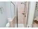 Tiled walk-in shower, including toilet and showerhead at 729 Lochaven Rd, Waxhaw, NC 28173