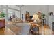 Cozy living room featuring hardwood floors, comfortable furniture, and natural light at 7815 Scottsburg Ct, Mint Hill, NC 28227
