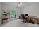 Office features large window, neutral colors, and a ceiling fan at 7815 Scottsburg Ct, Mint Hill, NC 28227