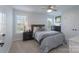 A cozy bedroom with natural light from two windows and ample closet space for storage at 8014 Avanti Dr, Marvin, NC 28173